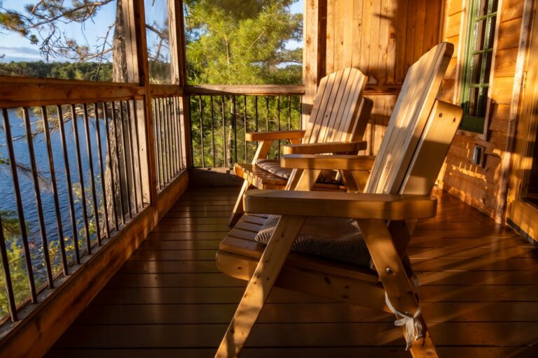 Adirondack chairs on cabin porch during a weekend getaway in cottage country from Toronto